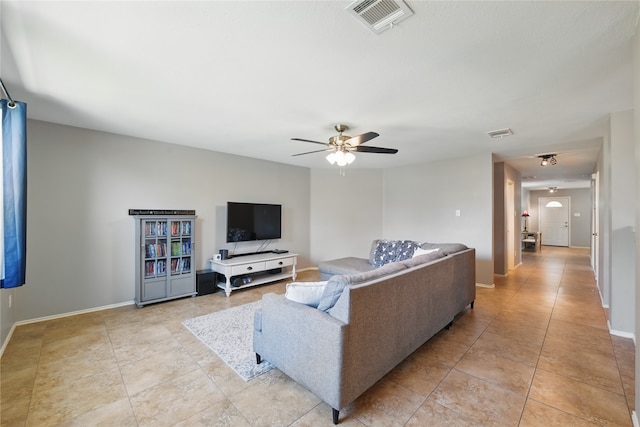 1833 Ramada Trl, Fort Worth, TX 76247 - living area featuring ceiling fan, light tile patterned flooring, and baseboards