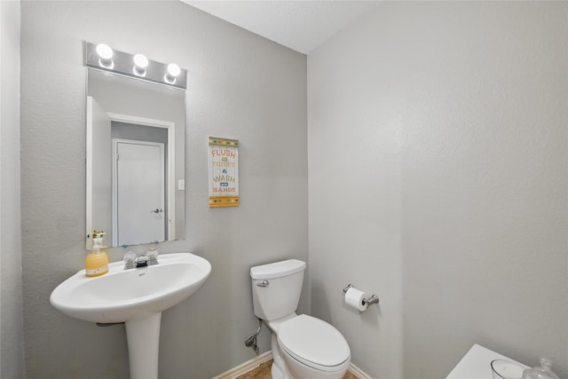 1833 Ramada Trl, Fort Worth, TX 76247 - bathroom featuring toilet and baseboards