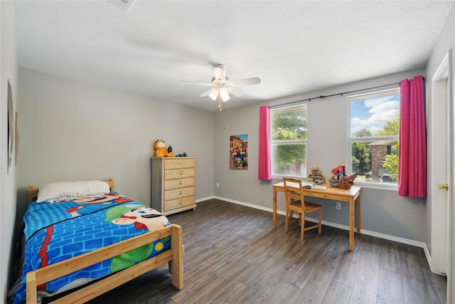 1833 Ramada Trl, Fort Worth, TX 76247 - bedroom featuring wood finished floors, baseboards, a textured ceiling, and ceiling fan