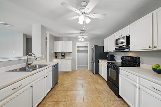 1833 Ramada Trl, Fort Worth, TX 76247 - kitchen featuring appliances with stainless steel finishes, a sink, white cabinetry, ceiling fan, and light countertops