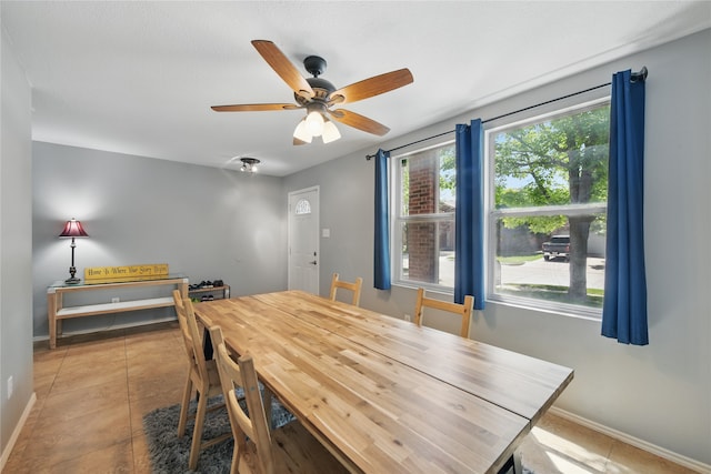 1833 Ramada Trl, Fort Worth, TX 76247 - dining room featuring baseboards, ceiling fan, and light tile patterned floors