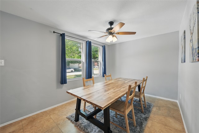 1833 Ramada Trl, Fort Worth, TX 76247 - dining space featuring a ceiling fan, baseboards, and light tile patterned floors