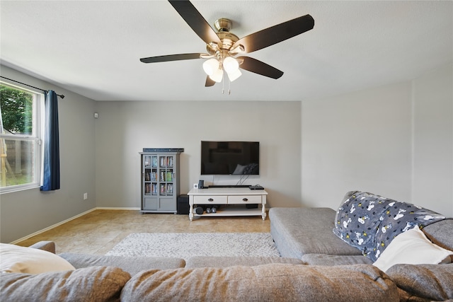 1833 Ramada Trl, Fort Worth, TX 76247 - living area featuring ceiling fan, tile patterned floors, and baseboards