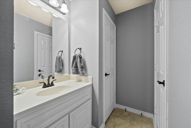 bathroom featuring vanity and baseboards