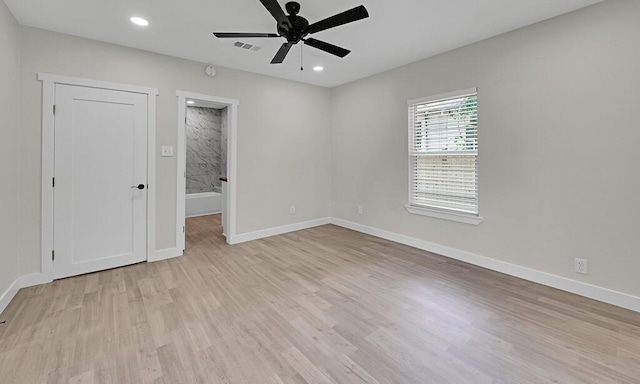 1713 Reuter Ave, Waco, TX 76708 - unfurnished bedroom with light wood-type flooring, baseboards, recessed lighting, ensuite bath, and a ceiling fan