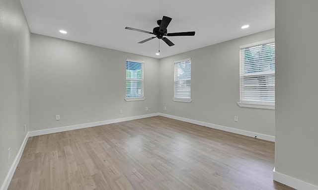 1713 Reuter Ave, Waco, TX 76708 - empty room with healthy amount of natural light, wood finished floors, ceiling fan, baseboards, and recessed lighting