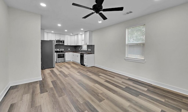 1713 Reuter Ave, Waco, TX 76708 - kitchen featuring stainless steel appliances, ceiling fan, recessed lighting, backsplash, and baseboards