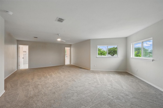 3169 Longbow Dr, Grand Prairie, TX 75052 - spare room featuring light carpet, baseboards, and ceiling fan