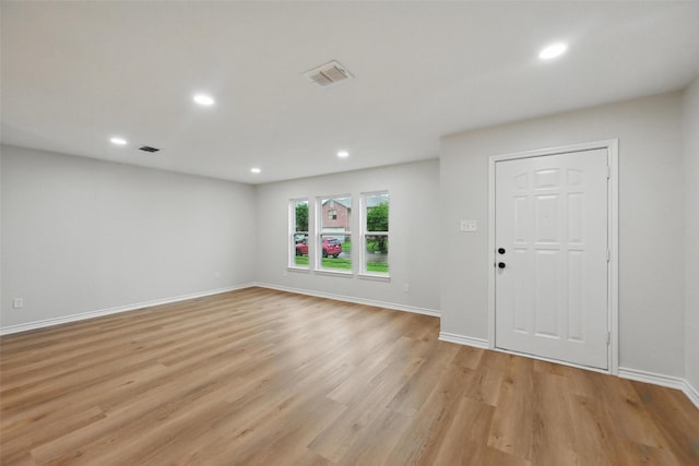 3169 Longbow Dr, Grand Prairie, TX 75052 - unfurnished living room with light wood-style flooring, recessed lighting, and baseboards
