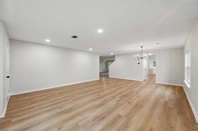 3169 Longbow Dr, Grand Prairie, TX 75052 - unfurnished living room with a chandelier, healthy amount of natural light, light wood-type flooring, recessed lighting, and baseboards