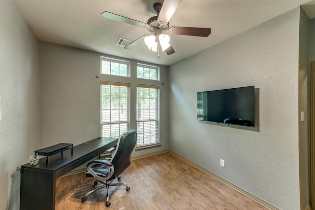 870 1st St, Maypearl, TX 76064 - office space featuring baseboards, wood finished floors, a ceiling fan, and a textured wall