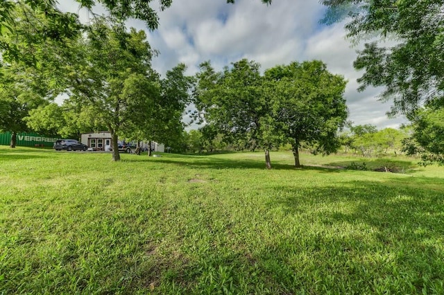 870 1st St, Maypearl, TX 76064 - view of grassy yard featuring view of wooded area