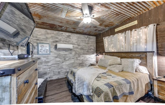 870 1st St, Maypearl, TX 76064 - bedroom with wood finished floors, wooden walls, wooden ceiling, an AC wall unit, and ceiling fan