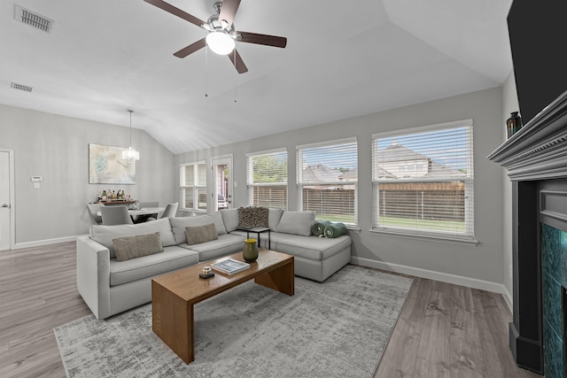4719 Highlands Dr, Mckinney, TX 75070 - living area featuring vaulted ceiling, a ceiling fan, light wood finished floors, a chandelier, and baseboards