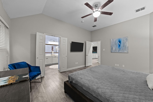 4719 Highlands Dr, Mckinney, TX 75070 - bedroom with wood finished floors, vaulted ceiling, ensuite bath, ceiling fan, and baseboards