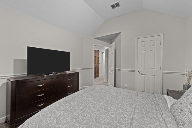 4719 Highlands Dr, Mckinney, TX 75070 - carpeted bedroom with vaulted ceiling and baseboards