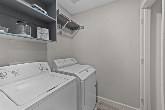 4719 Highlands Dr, Mckinney, TX 75070 - laundry area featuring washer and dryer, baseboards, and wood finished floors
