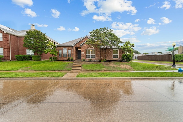 4719 Highlands Dr, Mckinney, TX 75070 - traditional-style home with brick siding and a front yard