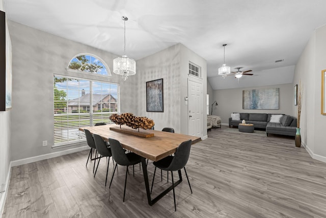 4719 Highlands Dr, Mckinney, TX 75070 - dining room with a chandelier, baseboards, wood finished floors, and ceiling fan