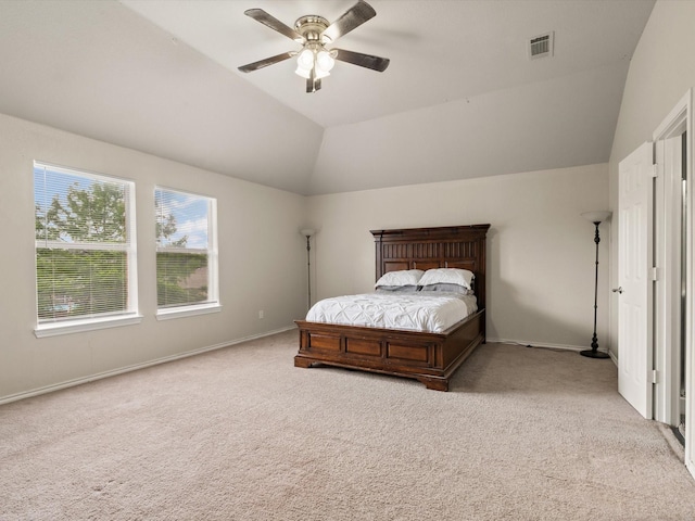 carpeted bedroom featuring lofted ceiling, ceiling fan, and baseboards