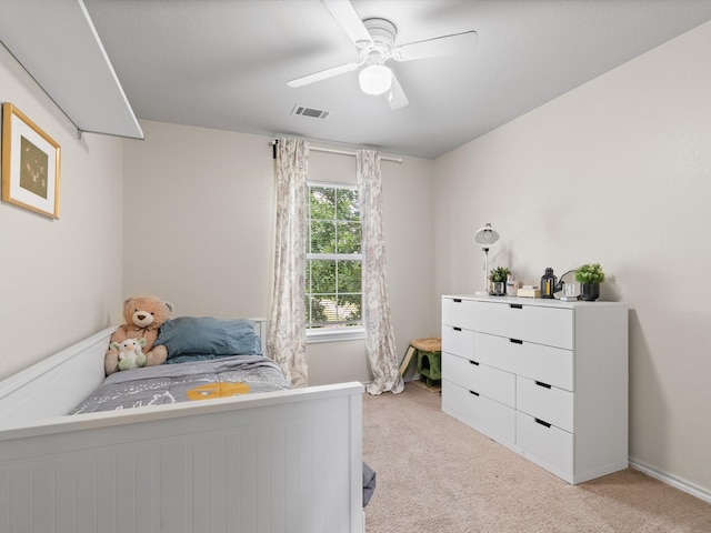 bedroom featuring light carpet and ceiling fan