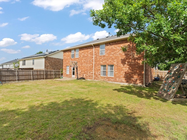 rear view of house with brick siding