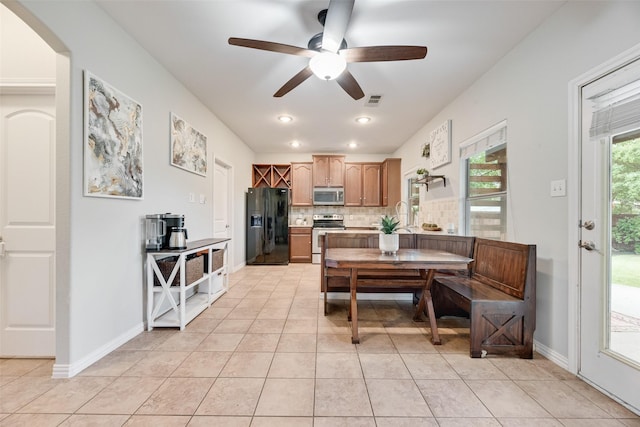 5221 Buckthorn Dr, Mckinney, TX 75071 - dining room with ceiling fan, light tile patterned flooring, arched walkways, and recessed lighting