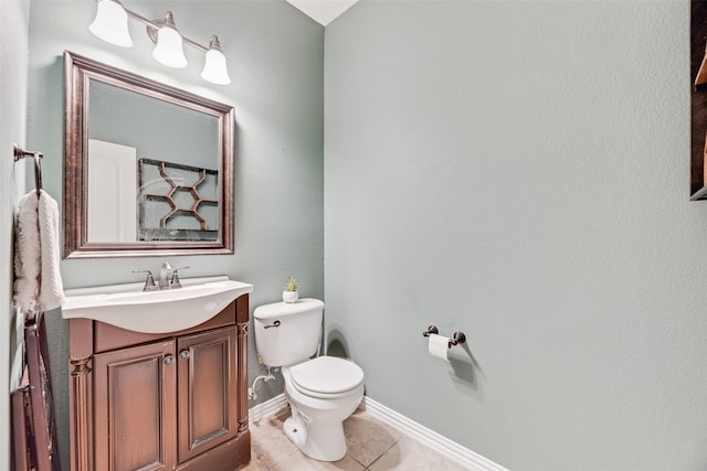 5221 Buckthorn Dr, Mckinney, TX 75071 - half bath featuring toilet, vanity, tile patterned floors, and baseboards