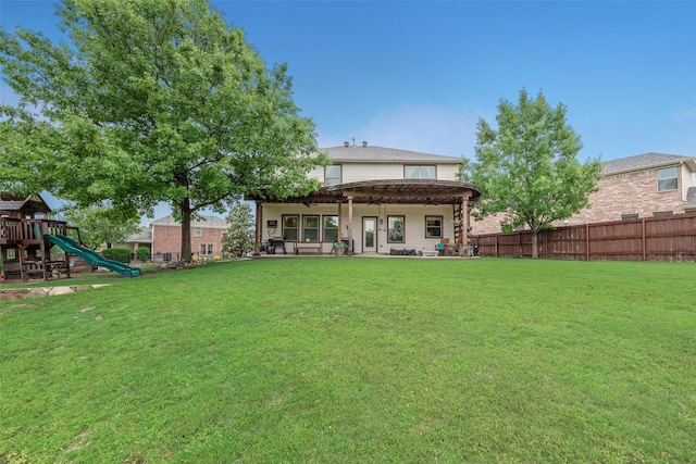 5221 Buckthorn Dr, Mckinney, TX 75071 - rear view of house with a ceiling fan, a patio, and a playground