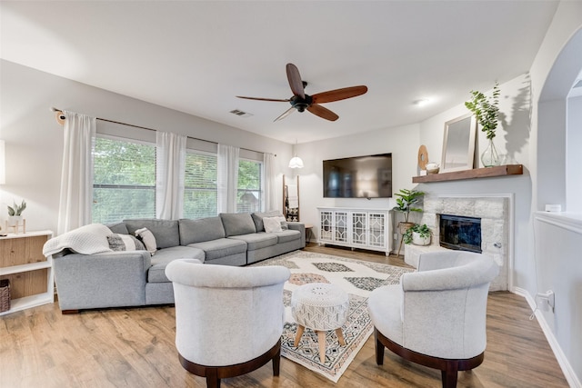 5221 Buckthorn Dr, Mckinney, TX 75071 - living room featuring ceiling fan, wood finished floors, a high end fireplace, and baseboards