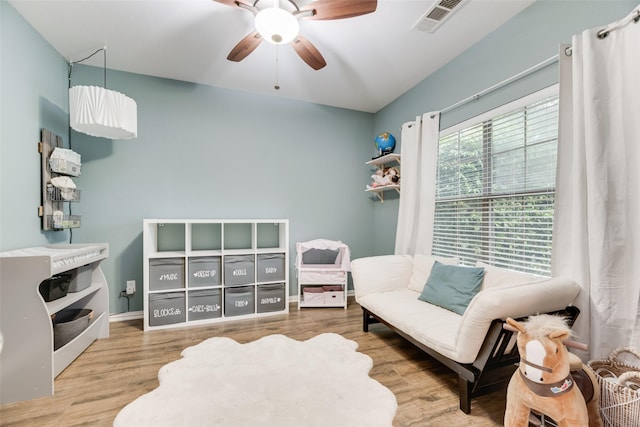 5221 Buckthorn Dr, Mckinney, TX 75071 - living area featuring a ceiling fan, wood finished floors, and baseboards
