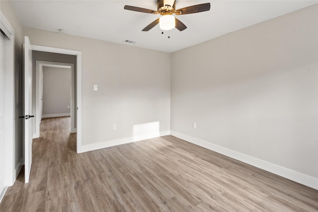 4205 Humphrey Dr, Dallas, TX 75216 - empty room with light wood-style flooring, baseboards, and ceiling fan