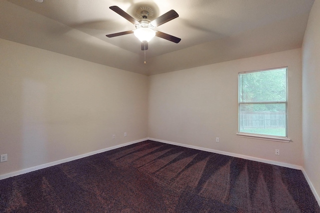 4861 Nuevo Laredo Ct, Dallas, TX 75236 - spare room with dark carpet, ceiling fan, and baseboards