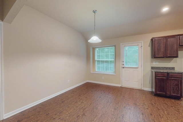 4861 Nuevo Laredo Ct, Dallas, TX 75236 - unfurnished dining area with dark wood-style flooring, baseboards, vaulted ceiling, and recessed lighting