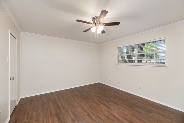 empty room with dark wood finished floors, ceiling fan, ornamental molding, and baseboards