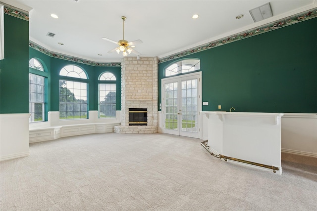 800 John Mccain Rd, Colleyville, TX 76034 - unfurnished living room with crown molding, a fireplace, a ceiling fan, carpet flooring, and recessed lighting