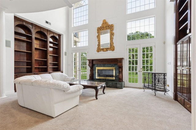 800 John Mccain Rd, Colleyville, TX 76034 - living area featuring a towering ceiling, carpet floors, french doors, and a fireplace