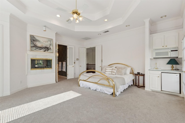 800 John Mccain Rd, Colleyville, TX 76034 - bedroom featuring ornamental molding, light carpet, recessed lighting, a tray ceiling, and ceiling fan