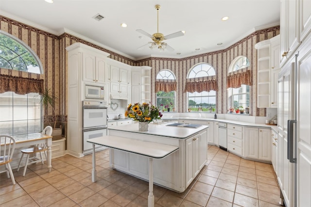 800 John Mccain Rd, Colleyville, TX 76034 - kitchen with wallpapered walls, white appliances, light tile patterned floors, a ceiling fan, and a kitchen island