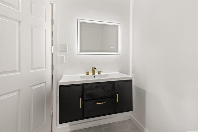 5726 Enchanted Ln, Dallas, TX 75227 - bathroom featuring vanity and baseboards