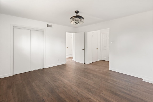 5726 Enchanted Ln, Dallas, TX 75227 - unfurnished bedroom featuring dark wood finished floors and baseboards