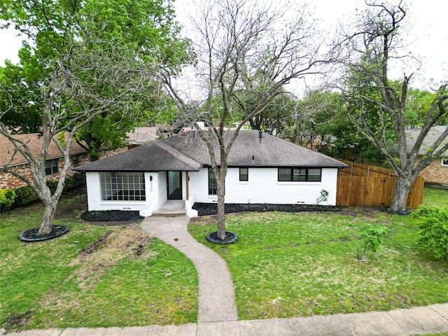 5726 Enchanted Ln, Dallas, TX 75227 - view of front of property with a shingled roof and brick siding