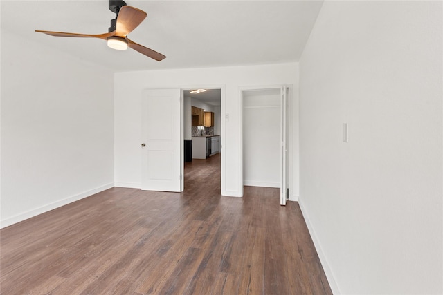 5726 Enchanted Ln, Dallas, TX 75227 - unfurnished room featuring dark wood-type flooring, baseboards, and a ceiling fan