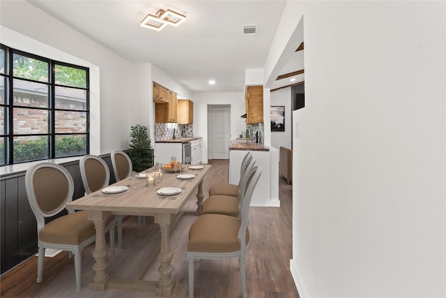 5726 Enchanted Ln, Dallas, TX 75227 - dining area with wood finished floors, recessed lighting, and baseboards