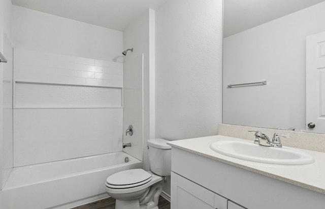 bathroom with toilet, shower / washtub combination, vanity, and wood finished floors
