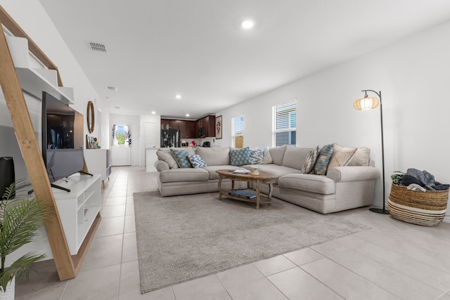 7613 Bluebell Ln, Mckinney, TX 75071 - living area featuring light tile patterned floors and recessed lighting