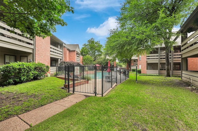 view of yard with a community pool