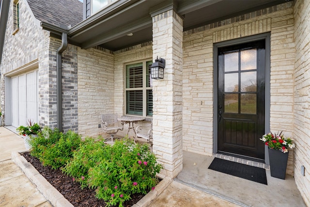 233 Park N Ln, Keller, TX 76248 - view of exterior entry with a porch, brick siding, a garage, and a shingled roof