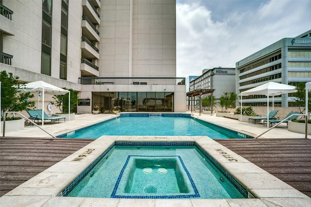 5909 Luther Ln Unit 1700, Dallas, TX 75225 - community pool with an in-ground hot tub and a patio