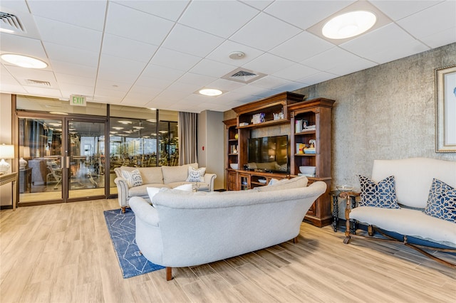 5909 Luther Ln Unit 1700, Dallas, TX 75225 - living room with light wood finished floors and a paneled ceiling